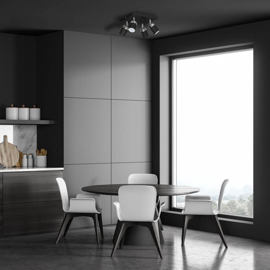 Punktowe oświetlenie nad okrągłym stołem w jadalni