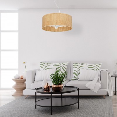 Wisząca lampa z kolekcji Cork nad stolikiem w salonie 